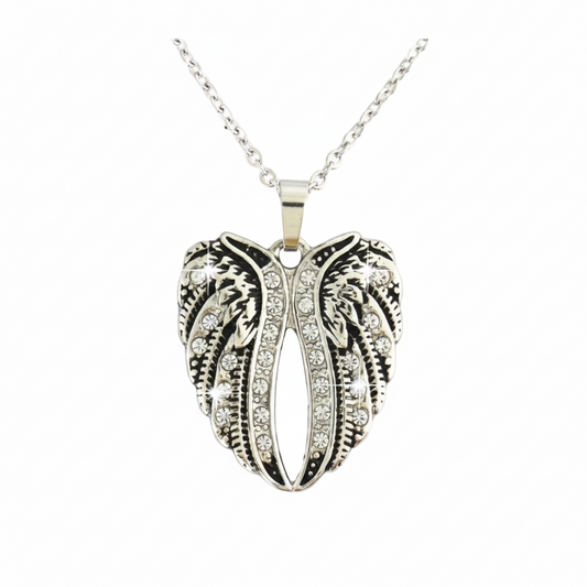 close-up of women's heart and wings pendant necklace, clear crystal stainless steel motorcycle jewelry